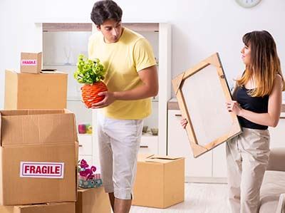 couple packing on moving day
