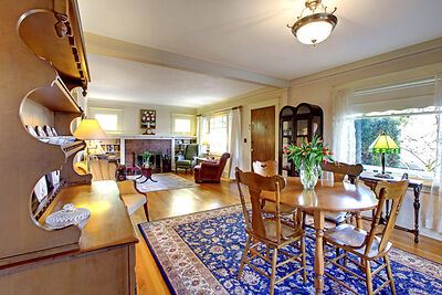 A rug in the dining room and living room