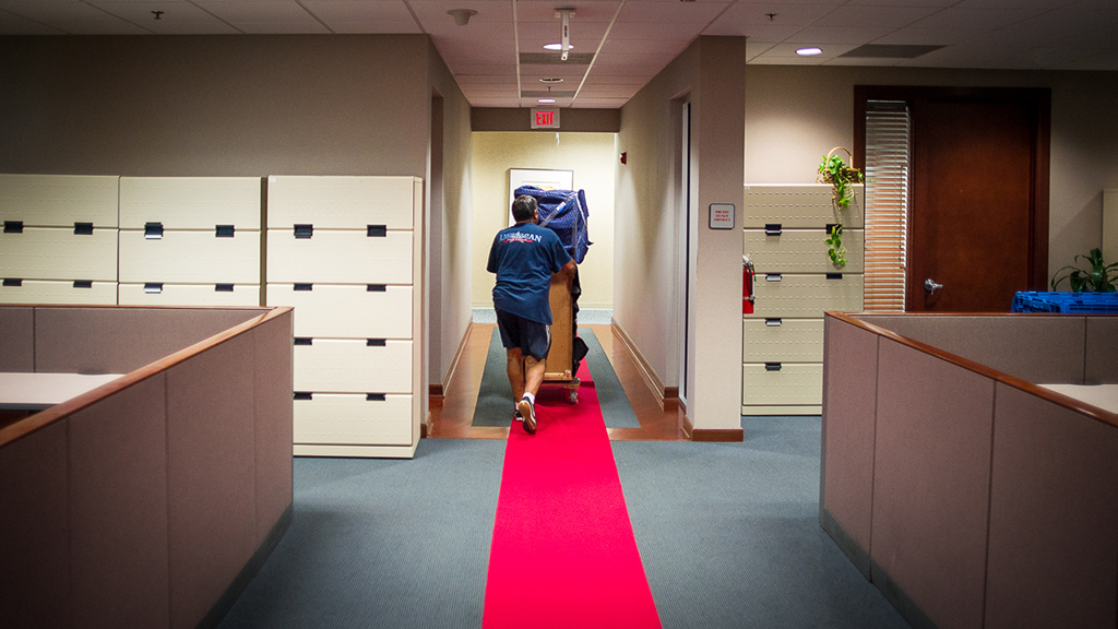 Office Moving - We lay protective flooring material, use rubber-wheeled dollies, and banister covers