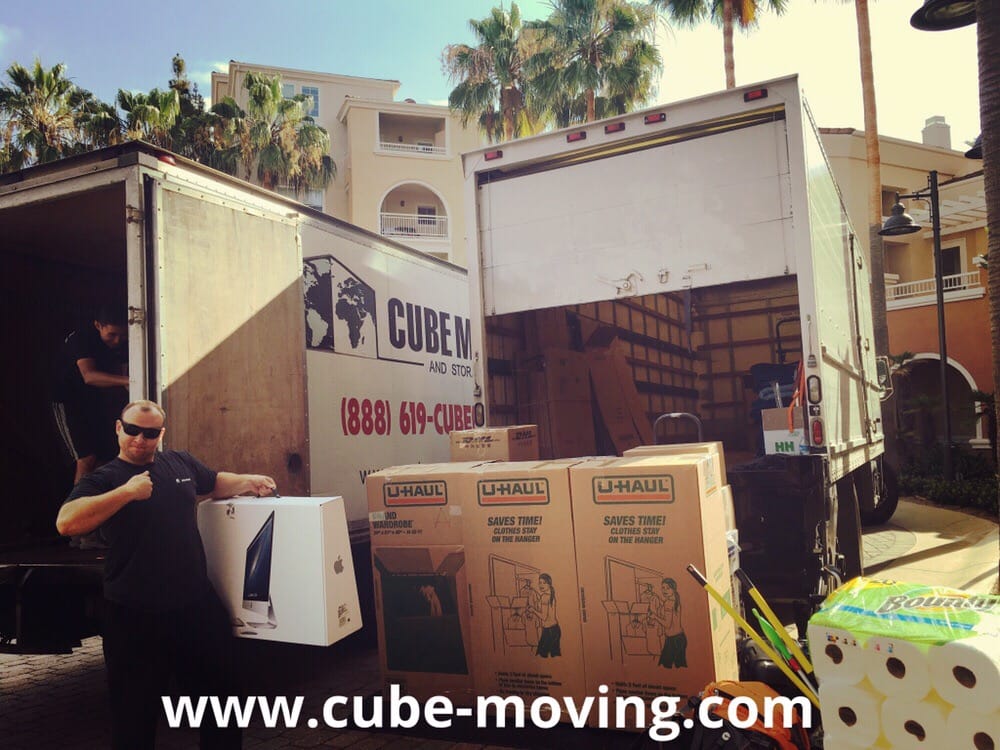 cube movers loading two 26 ft trucks