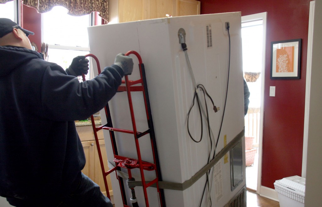 man-moving-fridge