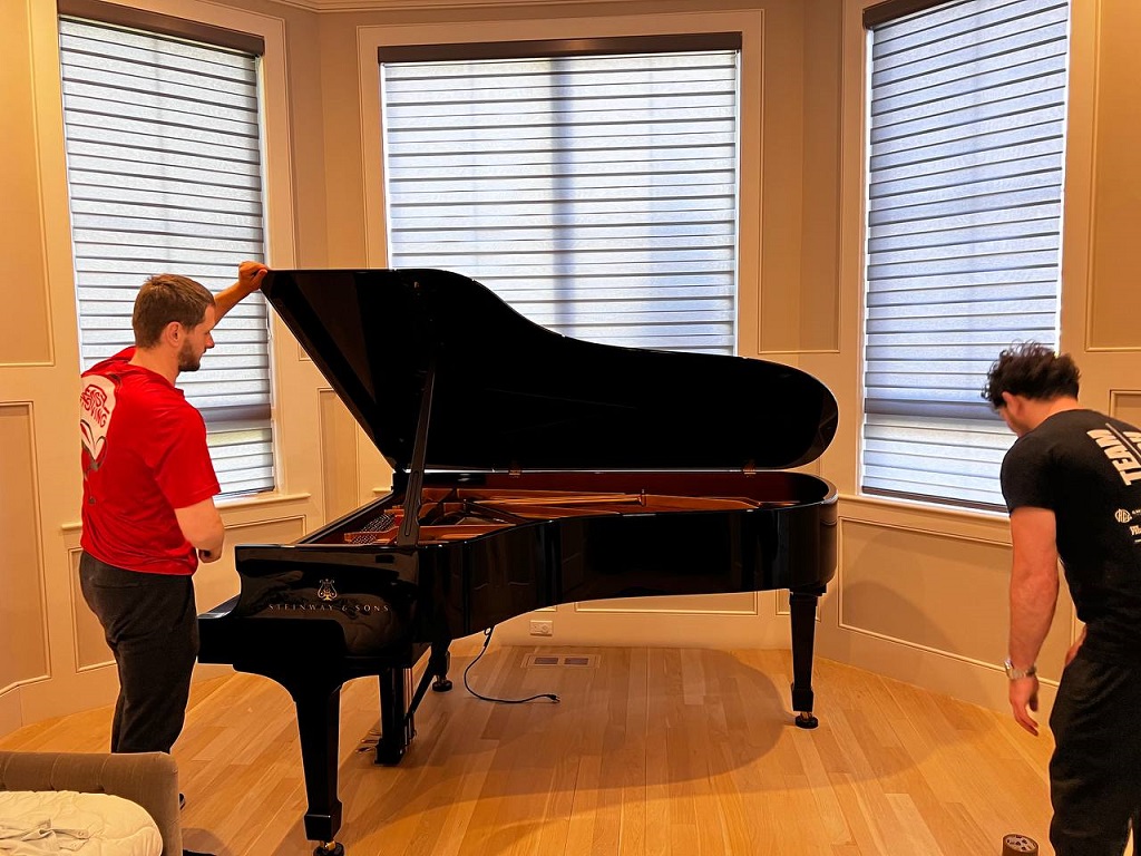 Crew Wrapping the Piano